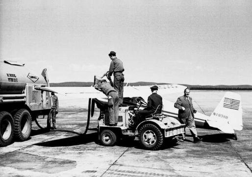US service personnel fuelling Luscombe N1838B at Goose Bay, Labrador. Peter Gluckmann can be seen striding towards the camera. Photo: Fritz Adam. 